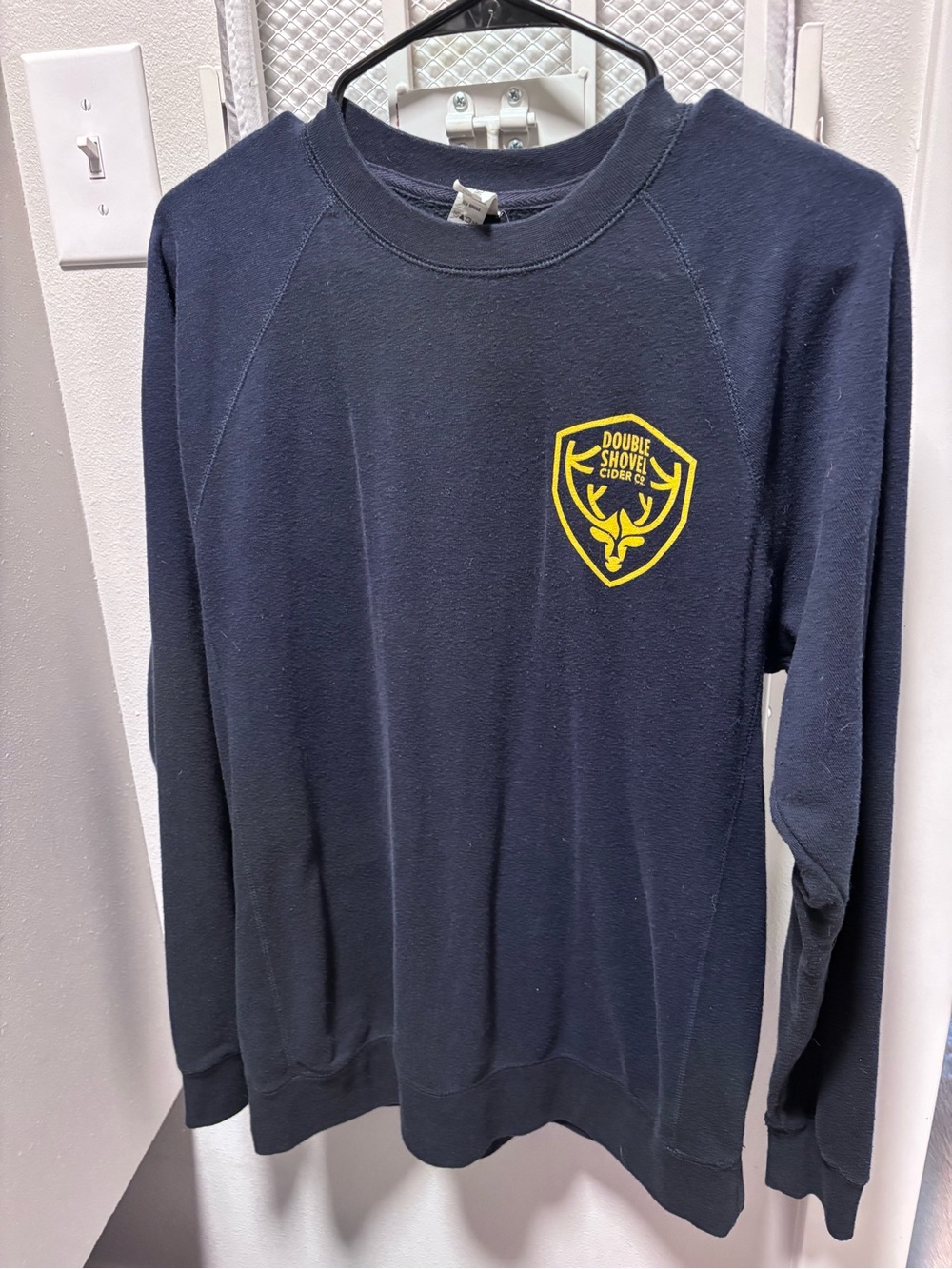 Hanes navy crewneck with yellow crest logo